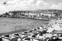 In_September_1956_holidaymakers_enjoying_the_sun_at_Military_Bay_in_Malta_28now_called_Ghajn_Tuffieha29_are_seemingly_unconcerned_by_the_landing_craft_sharing_the_beach_.jpg